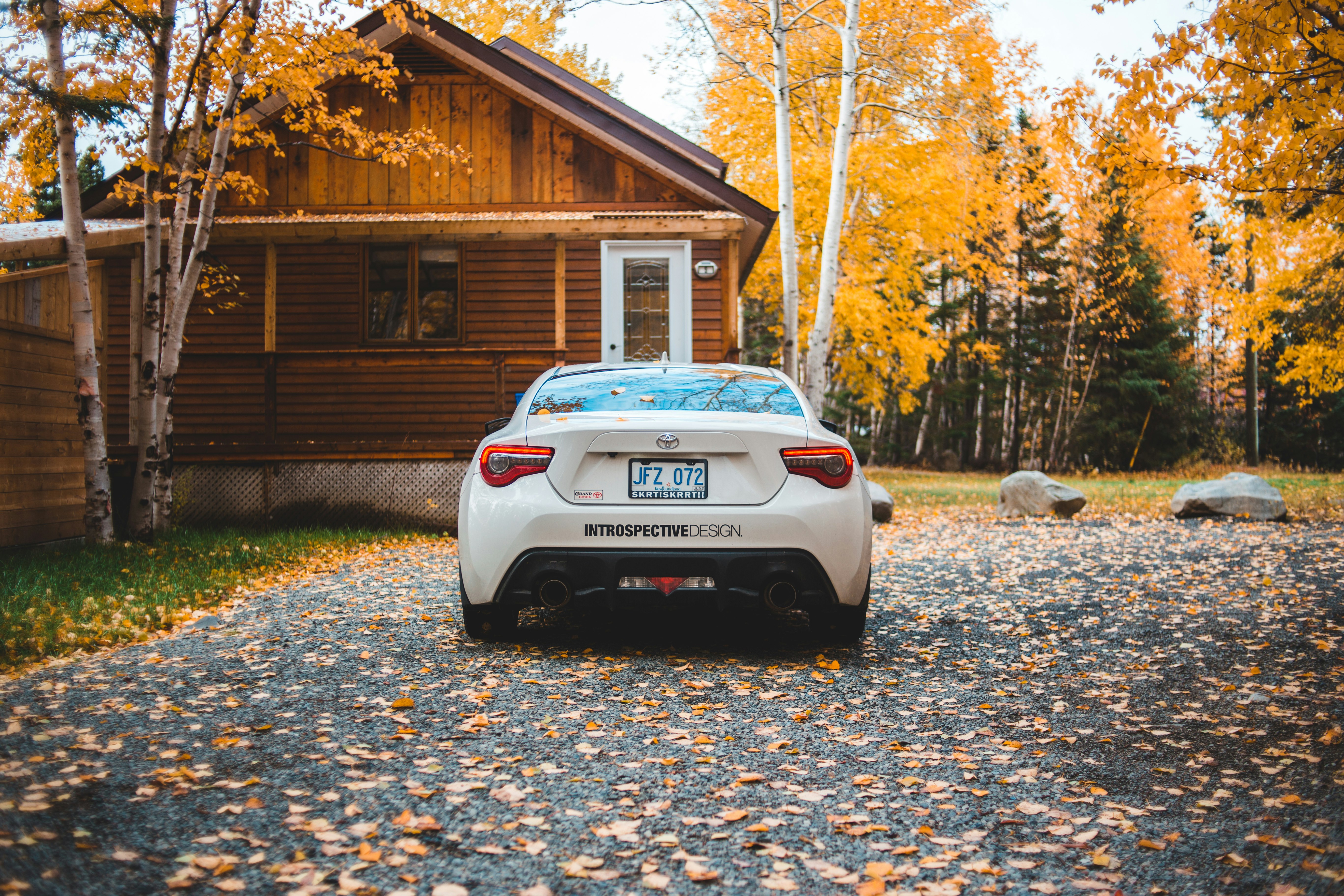 white vehicle beside house